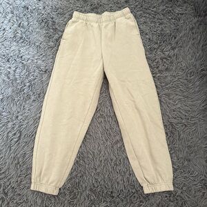 tan sweatpants with elastic waistband and cuffs